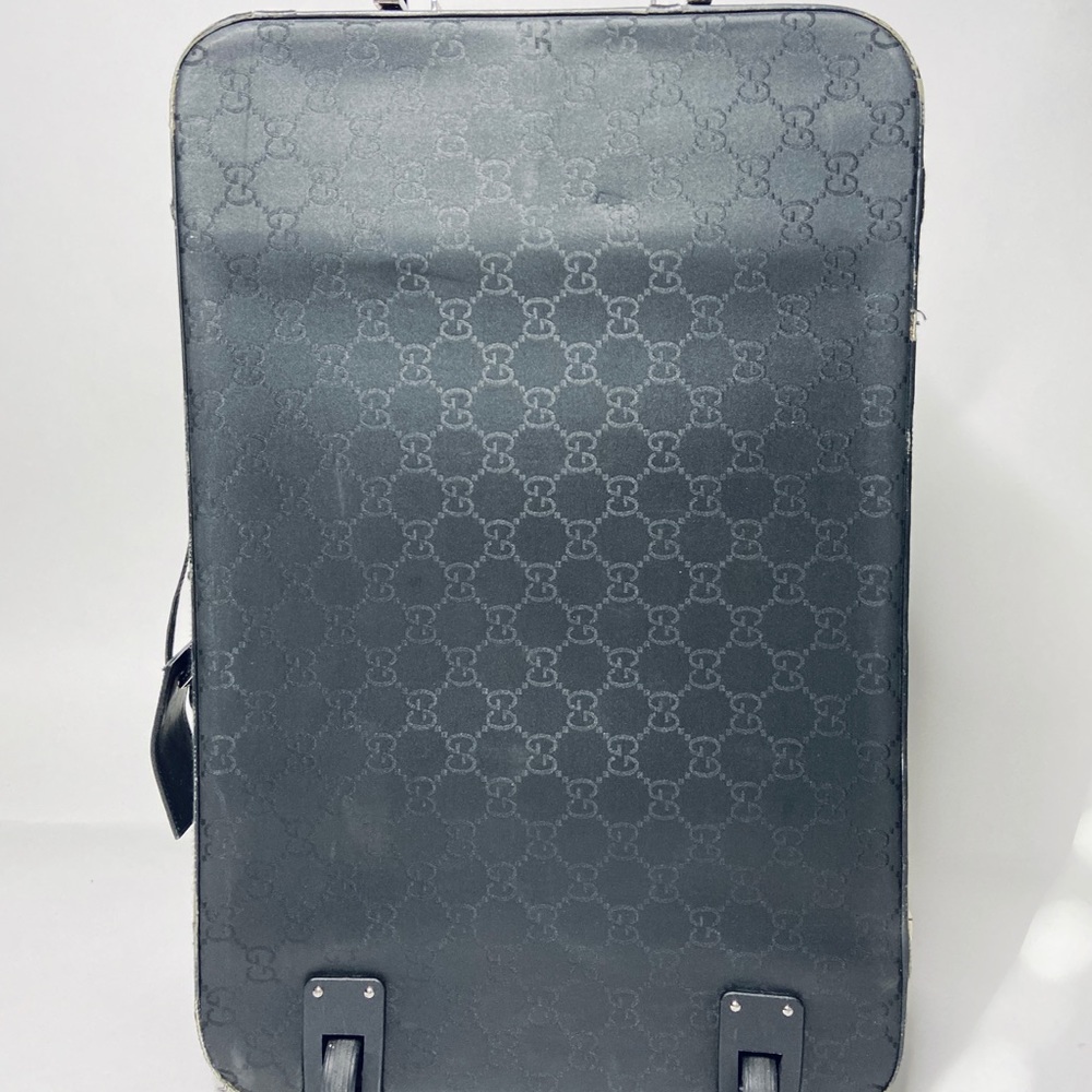 Sleek Gucci Monogram Roller Suitcase